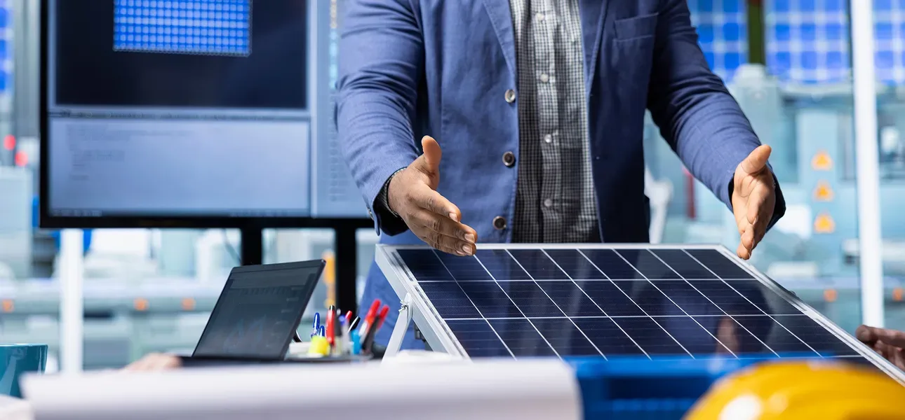 Engineer presenting a solar panel module during system design